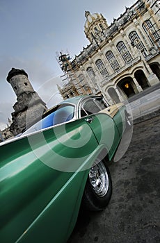 Green car perspective in havana, cuba