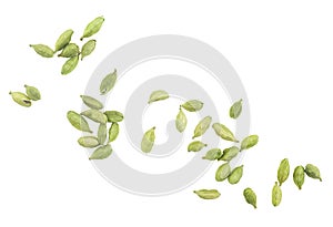 Green cardamom seeds isolated on white background, top view. Dried cardamom pods