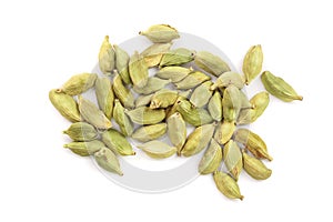 Green cardamom seeds isolated on white background. Top view. Flat lay