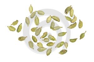 Green cardamom seeds isolated on white background. Top view. lay flat