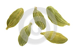 Green cardamom seeds isolated on white background. Top view. lay flat