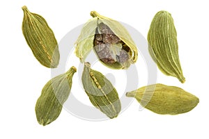 Green cardamom seeds isolated on white background. Top view. lay flat