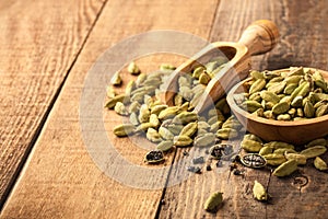 Green cardamom on wooden table