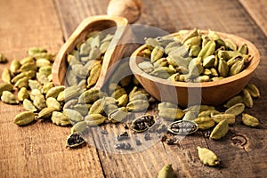 Green cardamom on wooden table