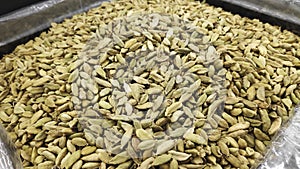 Green cardamon seeds on food market