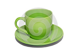 Green ceramic cup and saucer