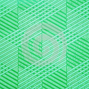 Green ceramic tile with geometric pattern for wall and floor decoration. Concrete stone surface background. Texture with