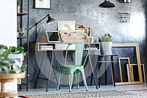 Green chair in designer`s room