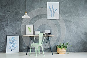 Green chair by the desk