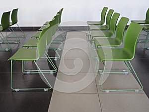 Green chairs rows in conference and presentation hall