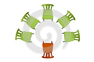 Green chairs stand on a white background in a semicircle, one orange chair, top view background, isolated