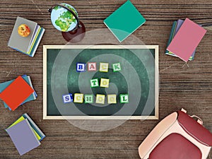 Green chalk board with wooden alphabet blocks arranged into Back to School text