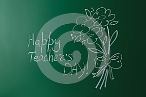 Green chalkboard with inscription HAPPY TEACHER`S DAY