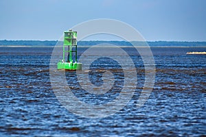 A green channel marker in Winyah bay.