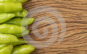 Green cheiro smell,scent peppers over wooden table with copy space photo
