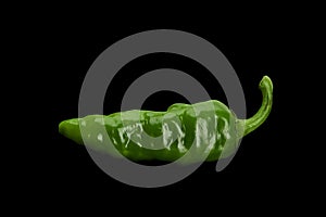 Green chili pepper on black