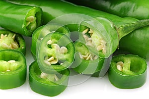 Green chili peppers and cut pieces