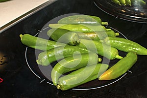 Green chilies on hot plate