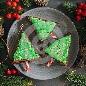 Green christmas sweet tree made from chocolate brownie. Cute idea for kids for christmas dessert