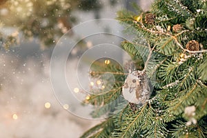 Green Christmas tree with pine cones