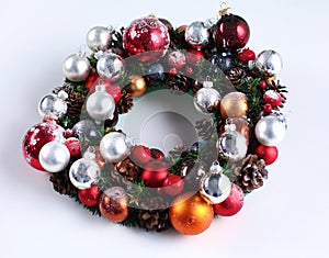 Green christmas wreath with decorations isolated