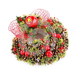Green christmas wreath with decorations on white background