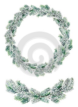 Green Christmas wreath in snow isolated on white