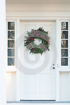 Green Christmas Wreath on White Door