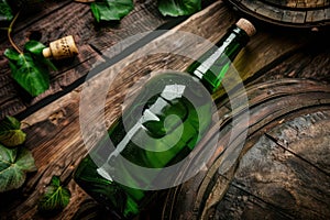 Green cider bottle on old wooden barrel, rustic beer bar. Generative AI