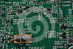Green circuit board with various electronic components