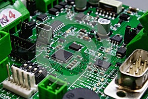 Green circuitboard with microcontroller and lots of connectors