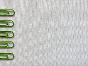 green clip on white fabric background
