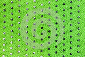 Green cloth with plastic circles