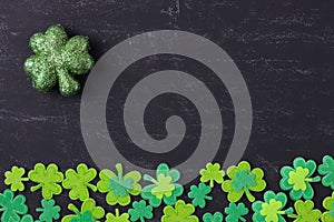 Green Clovers on Chalkboard