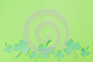 Green Clovers on Green Background Background for St. Patrick`s Day Holiday