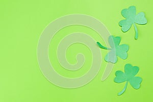 Green Clovers or Shamrocks on Green Background Background for St. Patrick`s Day Holiday