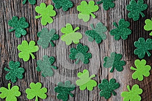 Green Clovers or Shamrocks on Rustic Wood