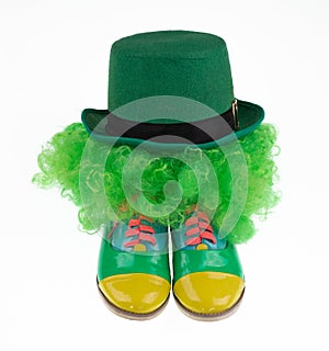 green clown hat and boots isolated on white