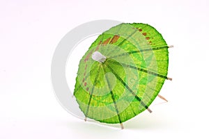 Green cocktail umbrella, top view