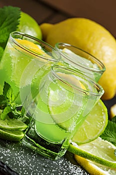 Green cocktail with vermouth, mint and citrus, selective focus