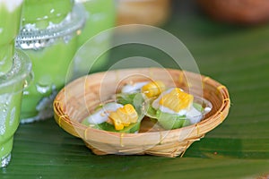 Green coconut sweet pudding and corn. Thai dessert