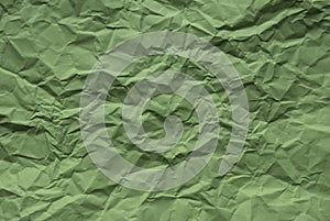 Green color crumpled paper for background