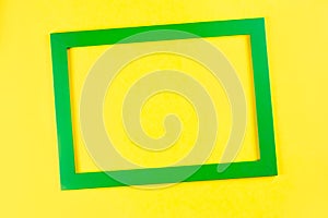 Green color frame on bright yellow background.