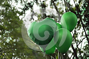 Green colored balloons - birthday party and revelation tea