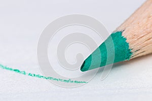 Green colour pencil with drawn line close up macro