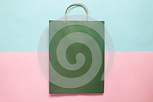 Green colour shopping bag mockup for branding and corporate identity design. Mock up paper bag on colour background