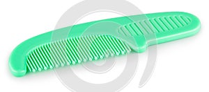 Green comb on a white background