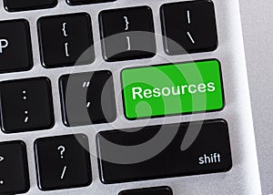 Green computer keyboard button with Resources word