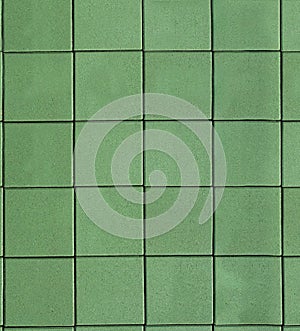 Green concrete tile on the ground. Background texture