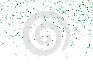 Green confetti, falling paper ribbons isolated on white background. Birthday party decoration.